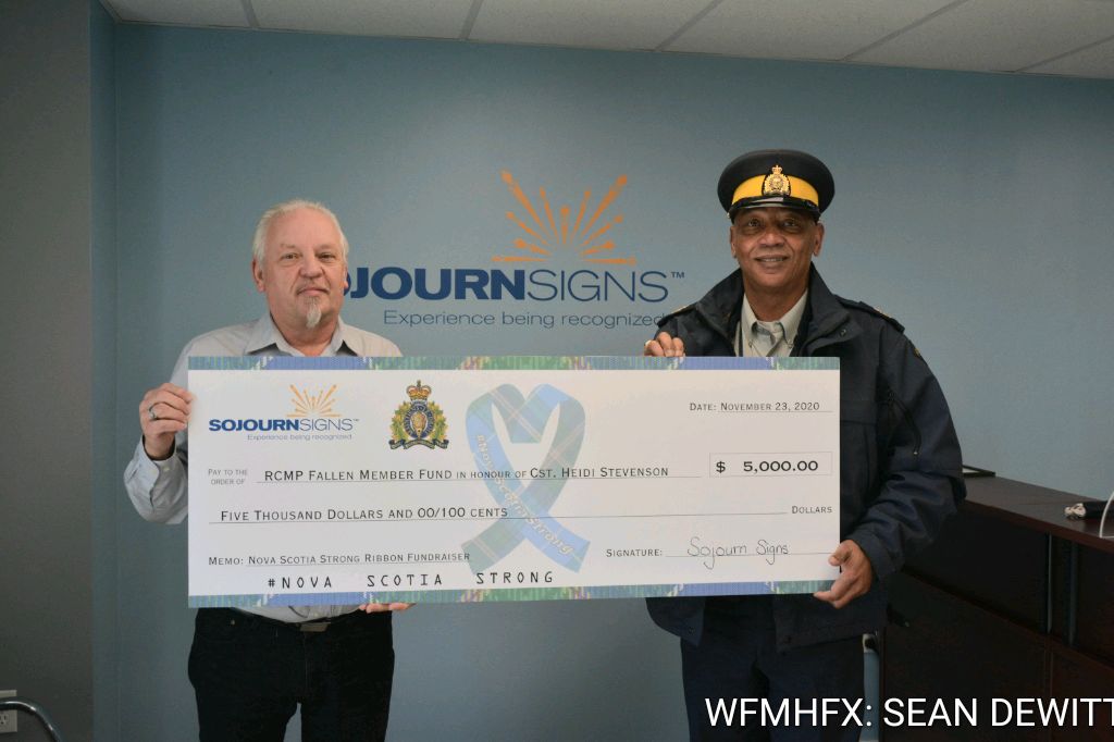 RCMP Sgt. Tony Upshaw received a cheque for $5,000.00 on behalf of the RCMP Foundation and the RCMP Fallen Officer Fund from Ribbon Fundraiser