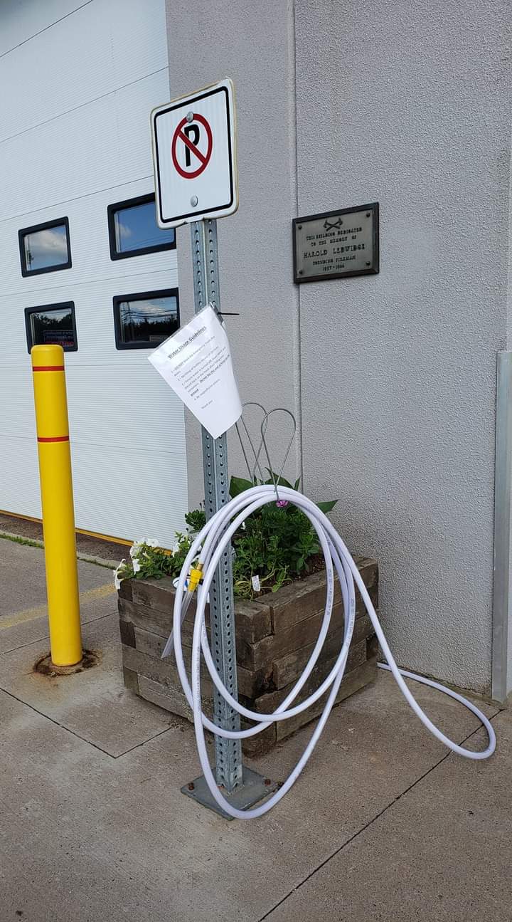 Enfield Fire has placed a food grade water hose outside the firehall for drinking water fill ups of 20L jugs or less