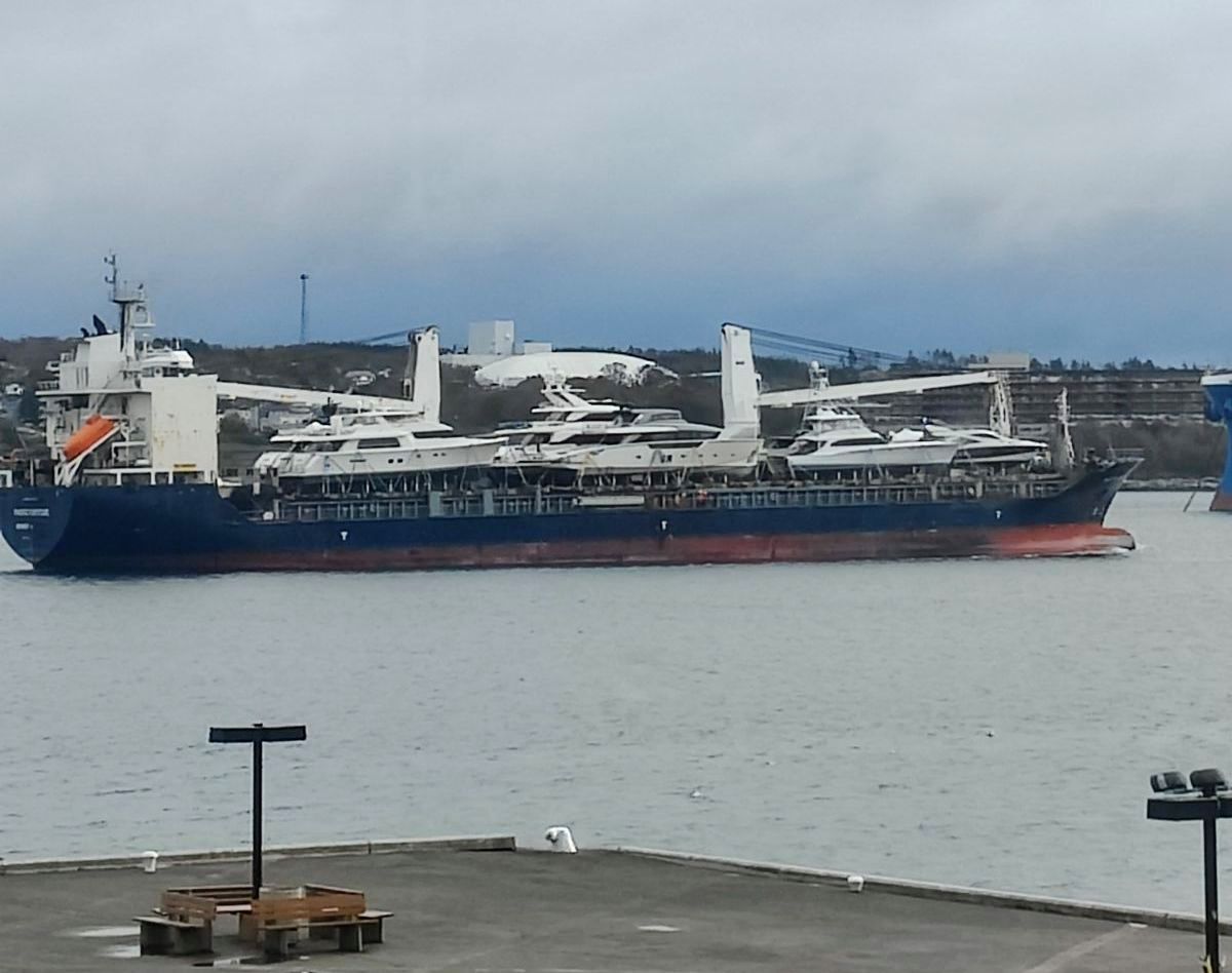 A ship shipping ships sailed near shore slowly out of Halifax earlier today