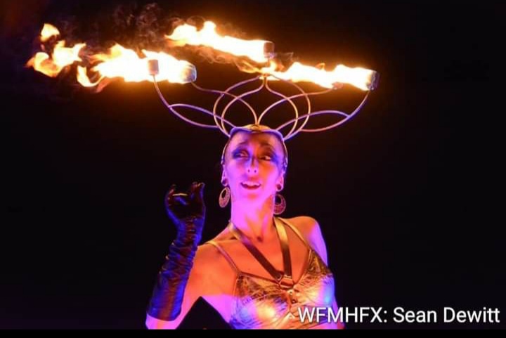 She's part of a team that heats up their shows with fire and lights