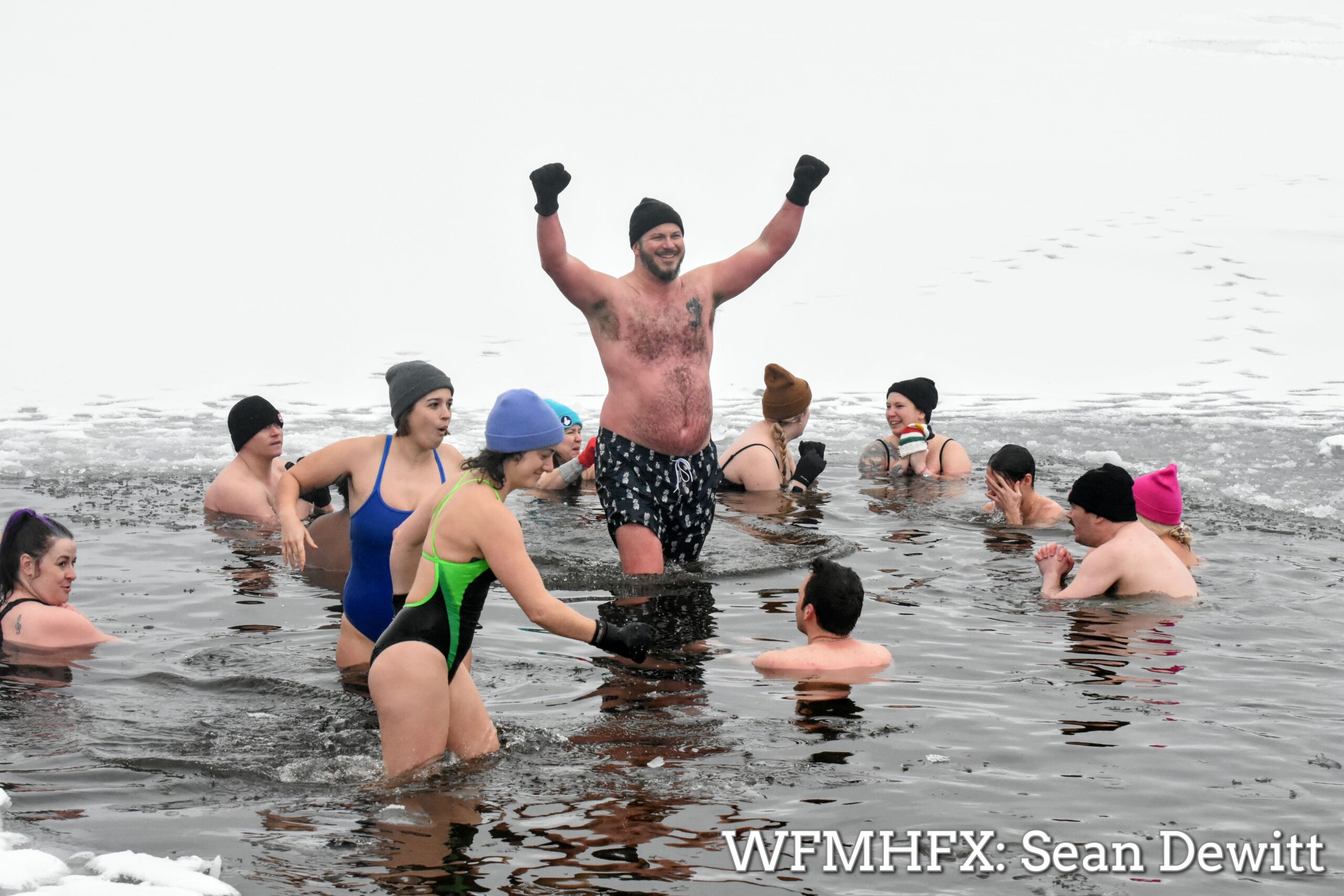 In photos - Flurries fell as more brave souls tackled the icy waters of Lake Banook
