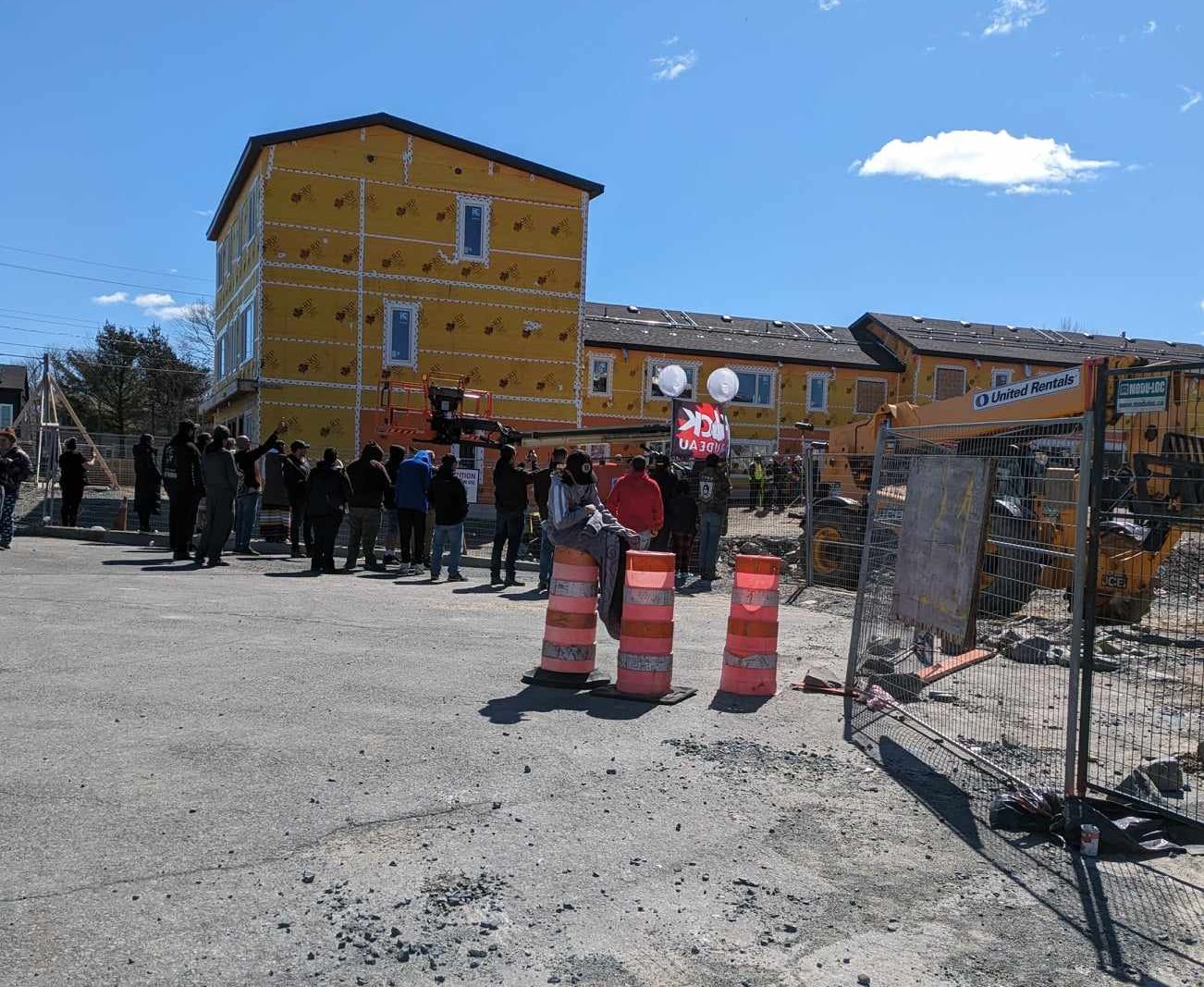A crowd of protesters gathered outside of a Trudeau announcement earlier in Dartmouth