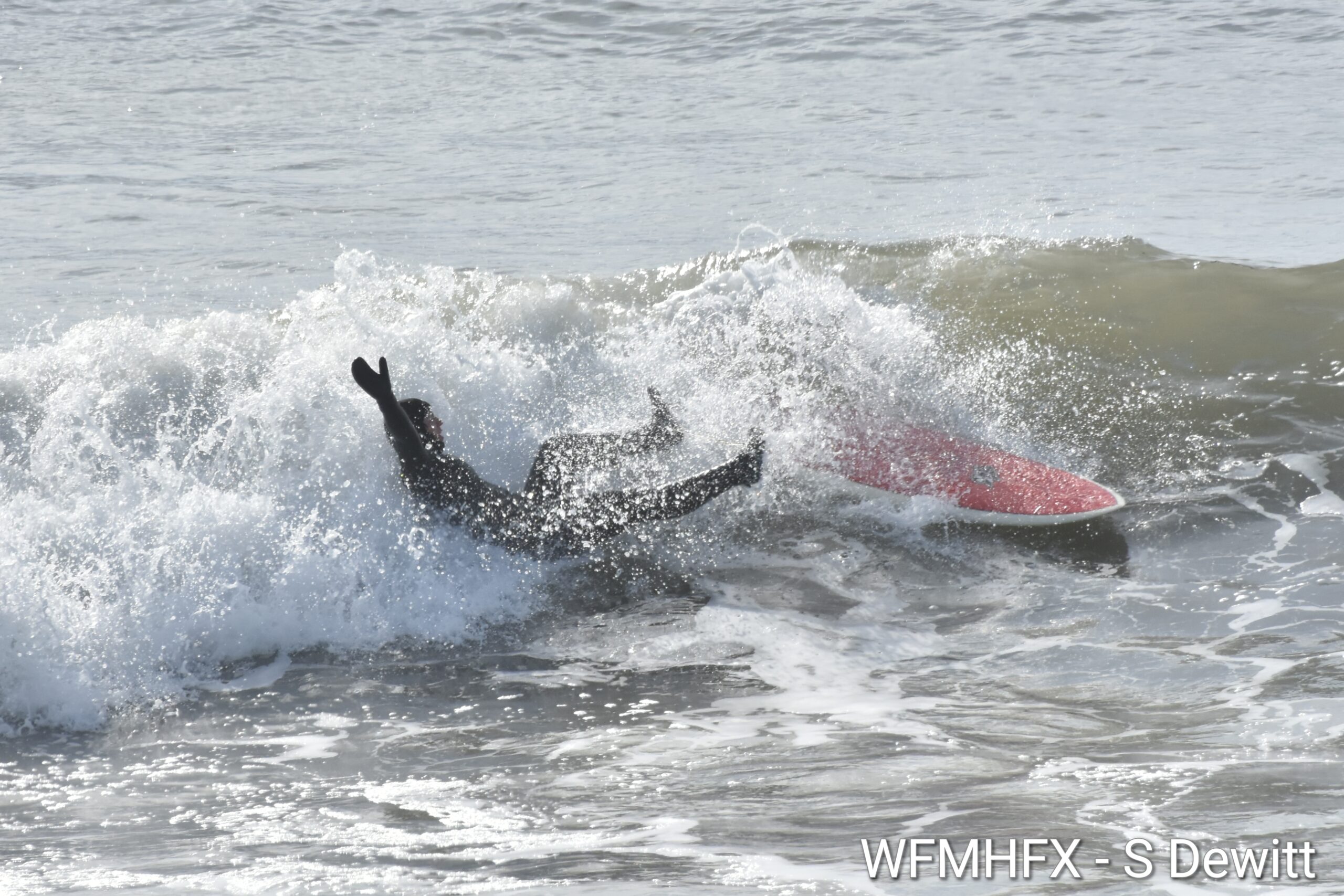 In photos - The rough before the storm! Surfers in Cow Bay take advantage of the waves and big sun as HRM prepares for a heavy rainfall