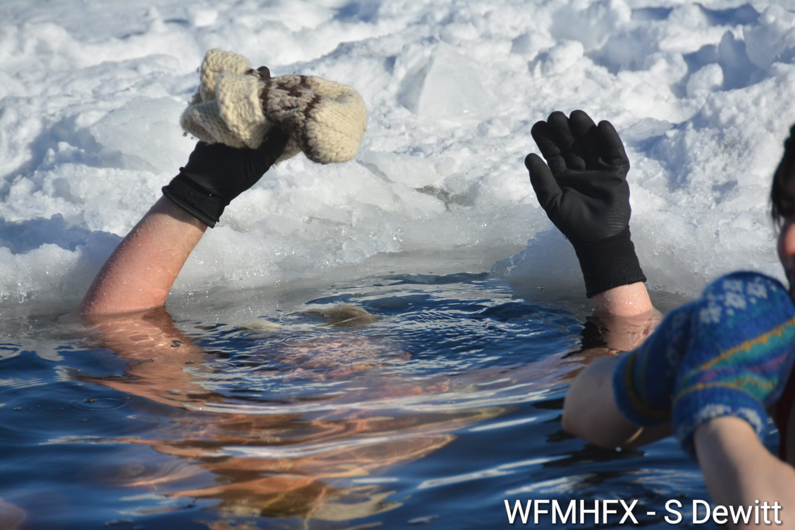 In photos - If a dipper sees their shadow, does that mean 6 more weeks of dipping? The Darkside Dippers take on the chilly temperatures as they hit Lake Banook as part of their weekly dips!