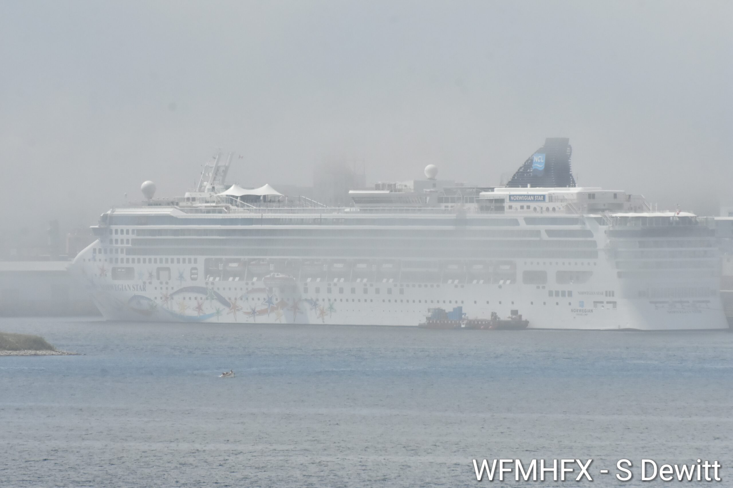 A high fog settles over the Halifax waterfront as temperatures climb today