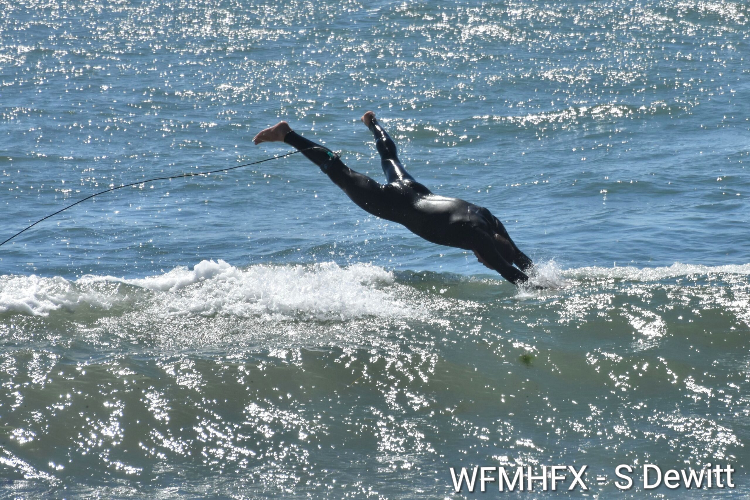 In photos - Cow Bay surfers ride the waves