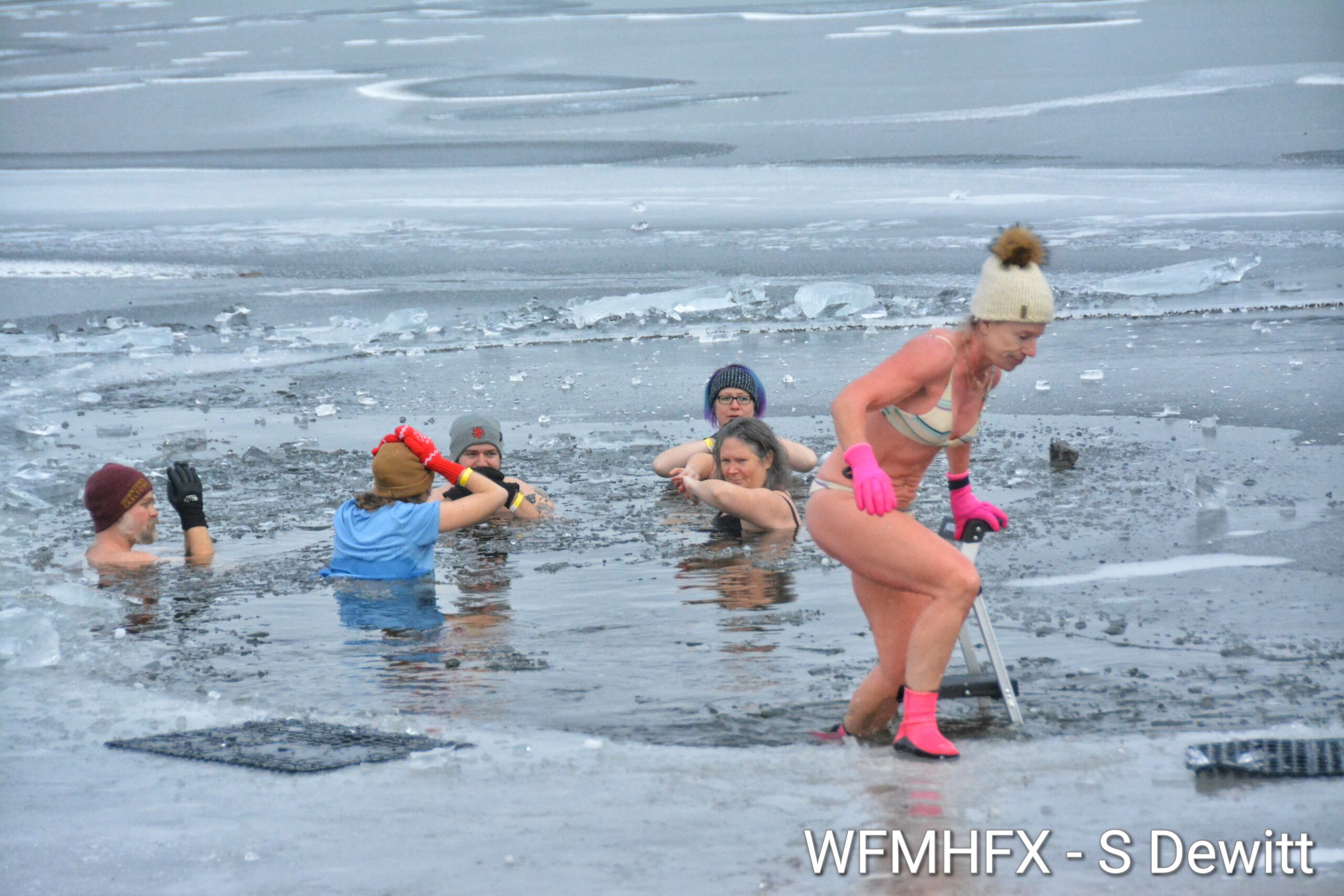 In photos - Staying cool as a cucumber as the Darkside Dippers take on the chilly waters of Lake Banook! 